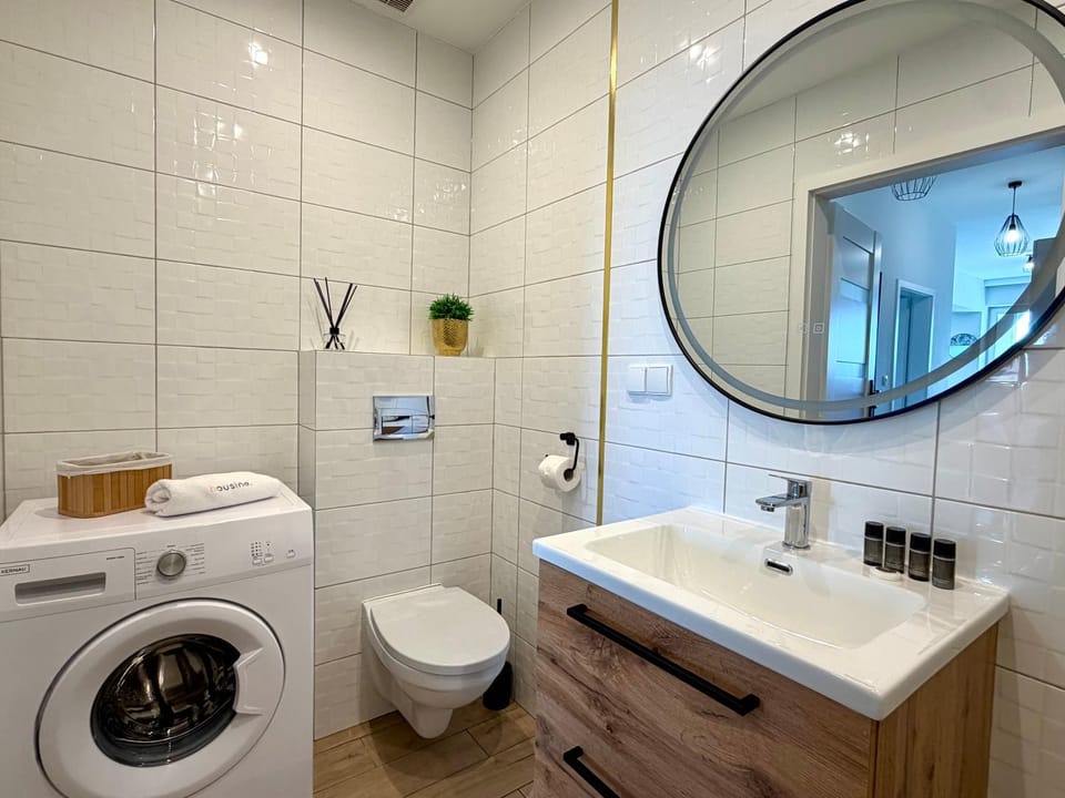 Shower, Toilet, Bathroom, towels, washing machine, dryer