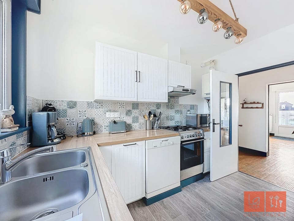 Kitchen or kitchenette, dishwasher, oven, stove, toaster