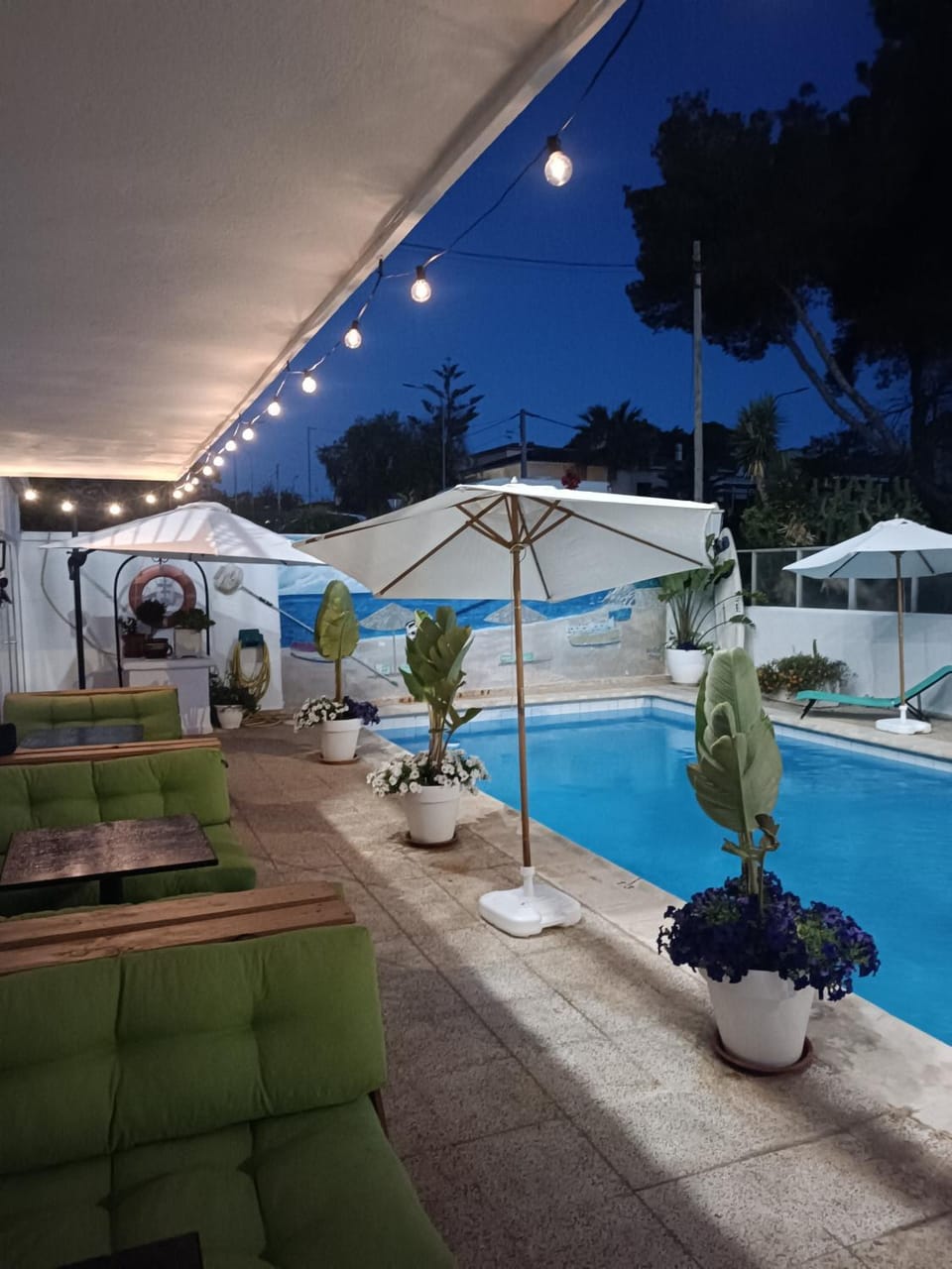 Patio, Night, Pool view, Swimming pool, sunbed