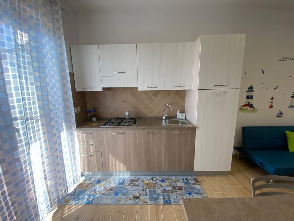Kitchen or kitchenette, Living room, stove