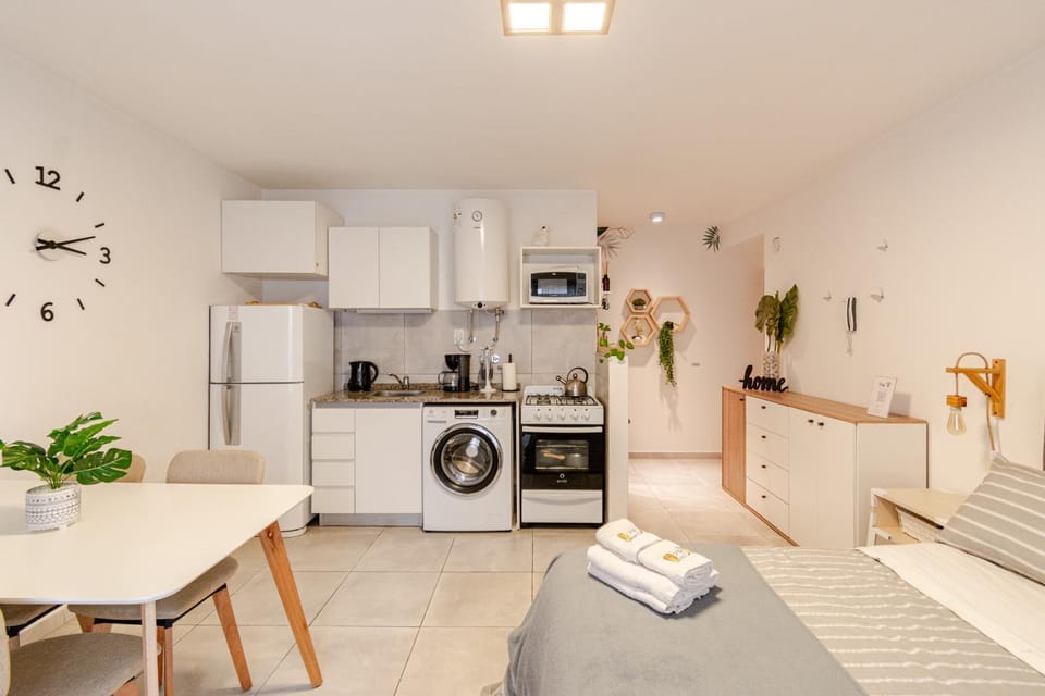 Bed, Dining area, Bedroom, microwave, oven, towels, washing machine, kitchen