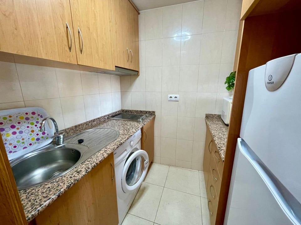 Kitchen or kitchenette, washing machine