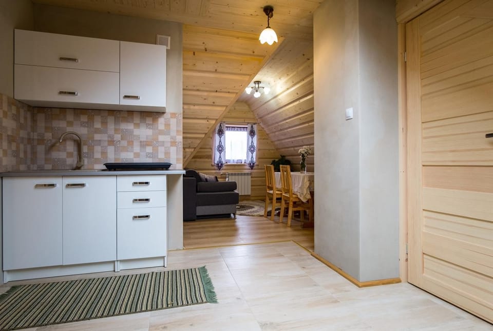Kitchen or kitchenette, Living room, Seating area, Dining area