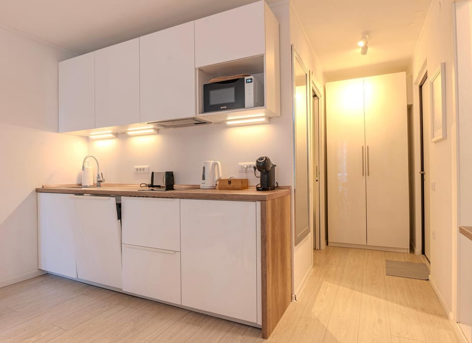 Photo of the whole room, microwave, kitchen