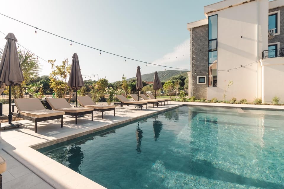 Property building, Day, Natural landscape, Pool view, Swimming pool, Swimming pool, sunbed