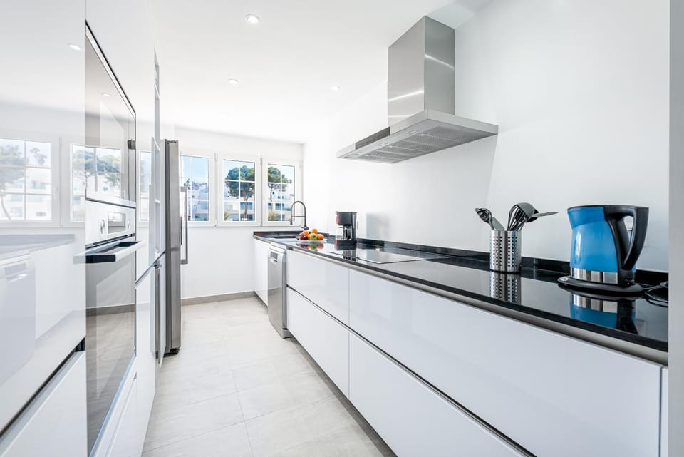 Kitchen or kitchenette, dishwasher, microwave, oven, stove, air conditioner