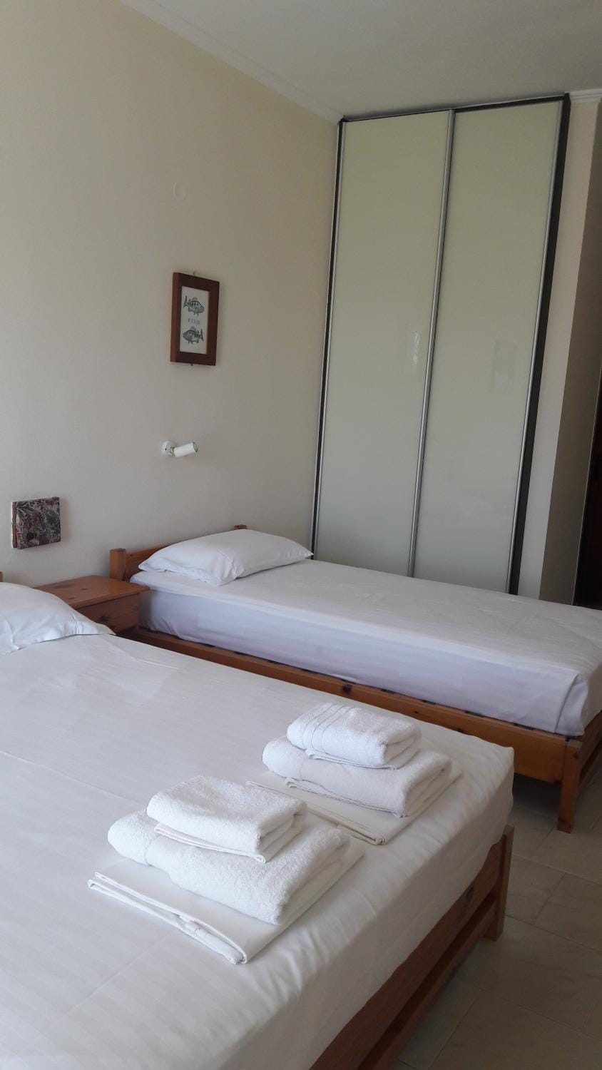 Bed, towels, wardrobe