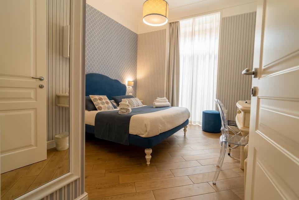 Bed, Decorative detail, Seating area, Bedroom, furniture, towels, air conditioner