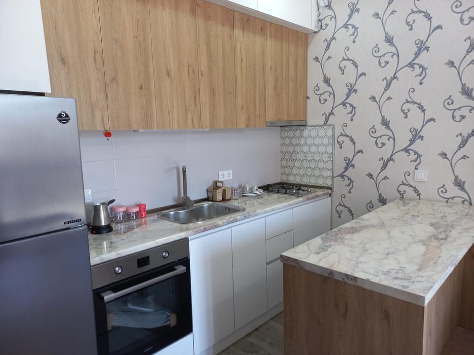 Kitchen or kitchenette, microwave, stove