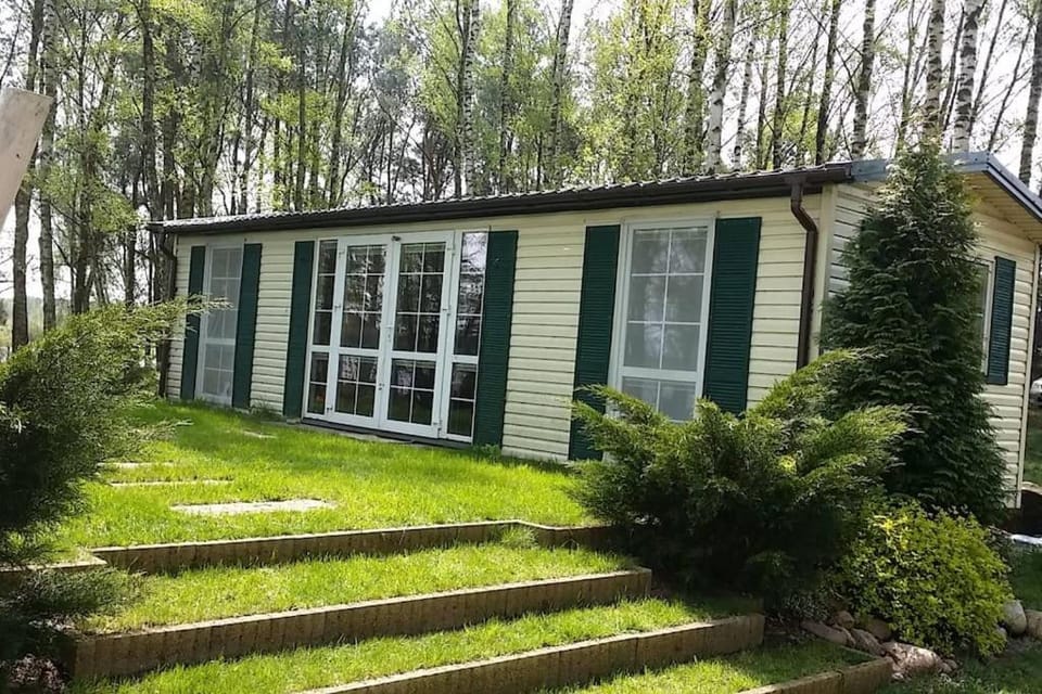 Linia brzegowa prywatny pomost własny kajak hamaki grill ognisko kominek w domu taras Domek dla 6 osób nad samą wodą BRZÓZKI 1 House in Masovian Voivodeship