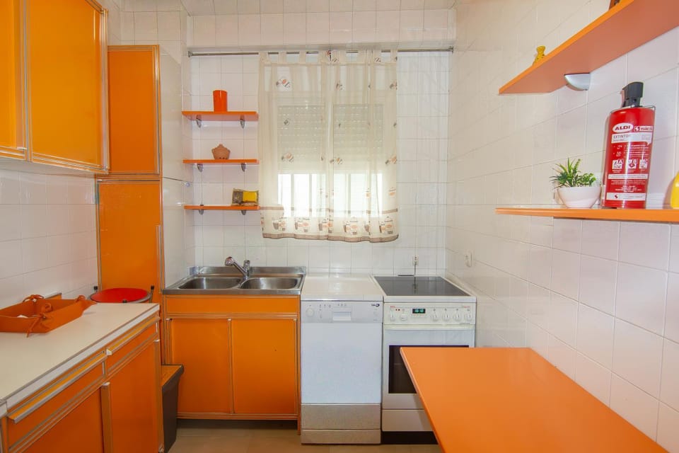 Kitchen or kitchenette, dishwasher, oven, stove