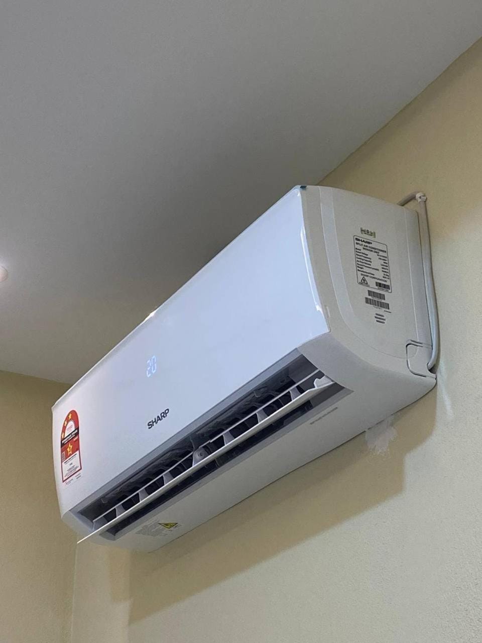 Property building, air conditioner, air conditioner