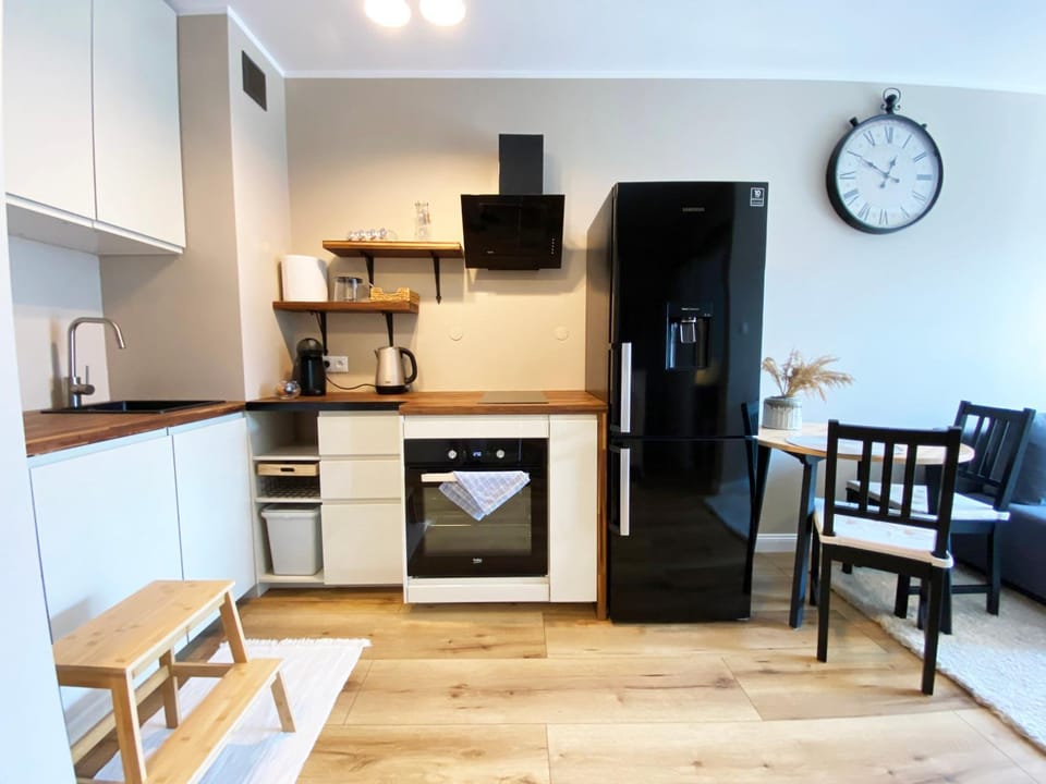 Kitchen or kitchenette, dishwasher, oven, stove