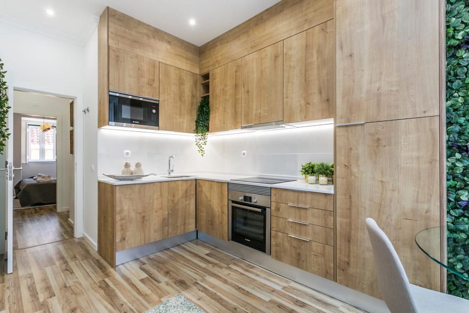 Kitchen or kitchenette, dishwasher, microwave, stove, toaster, washing machine, dryer