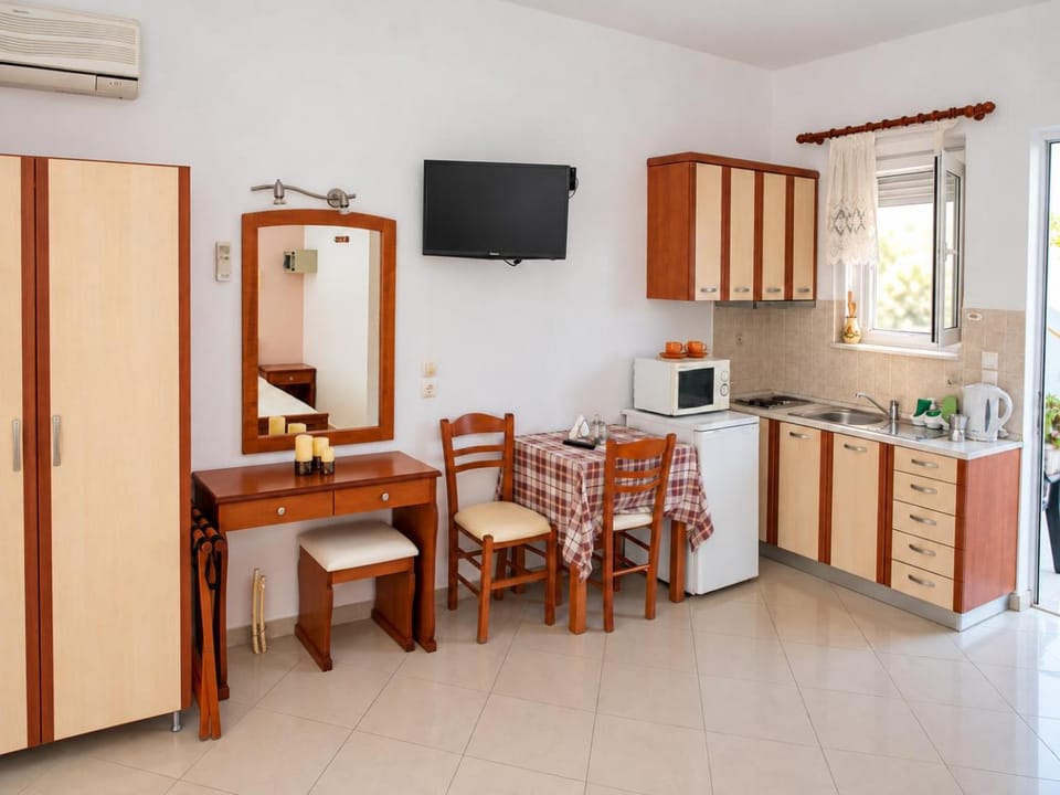 Kitchen or kitchenette, stove, toaster, air conditioner
