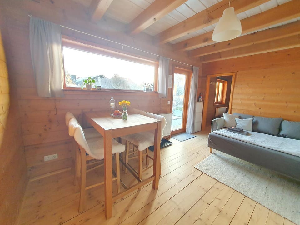 Bed, Living room, Seating area, Dining area