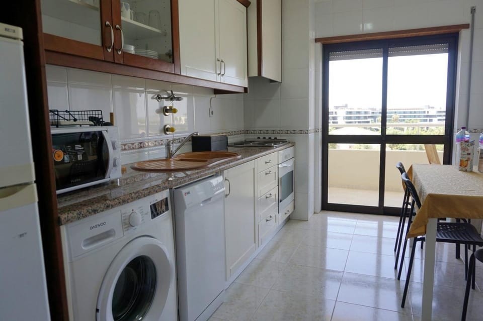 Kitchen or kitchenette, Dining area, dishwasher, oven, stove, toaster, washing machine