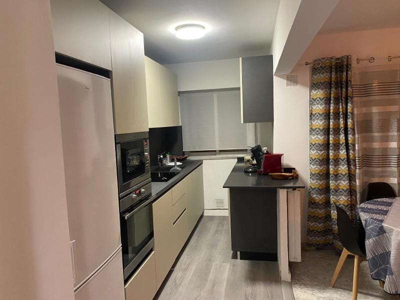 Kitchen or kitchenette, dishwasher, oven, stove