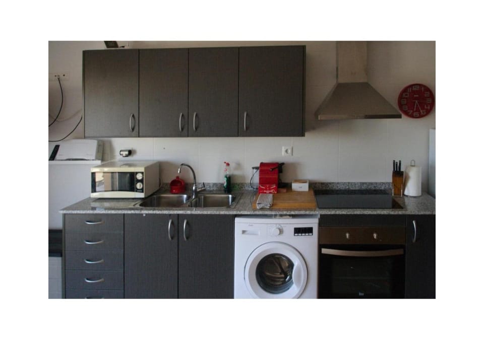 Kitchen or kitchenette, oven, stove, washing machine