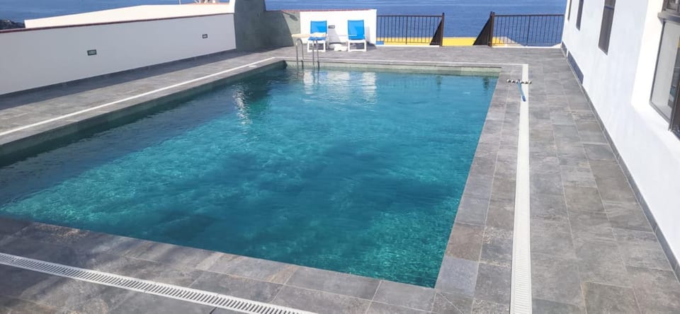 Property building, Living room, Swimming pool