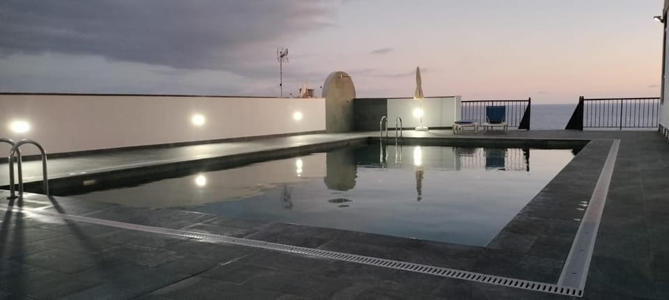 Property building, Living room, Swimming pool