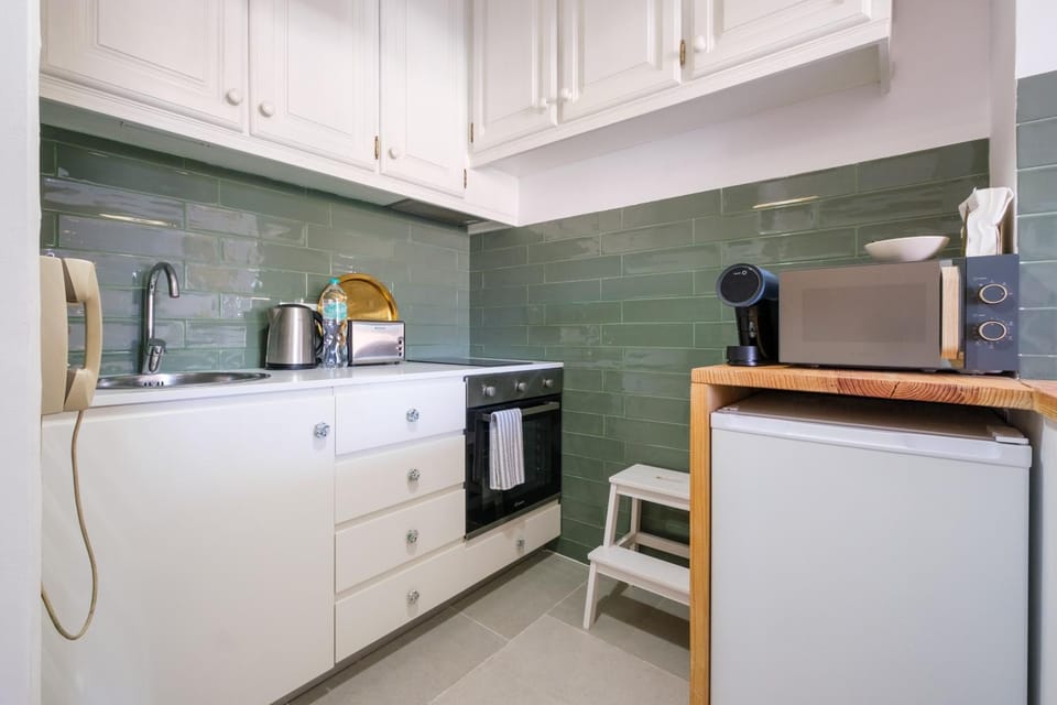 Kitchen or kitchenette, oven, stove, toaster