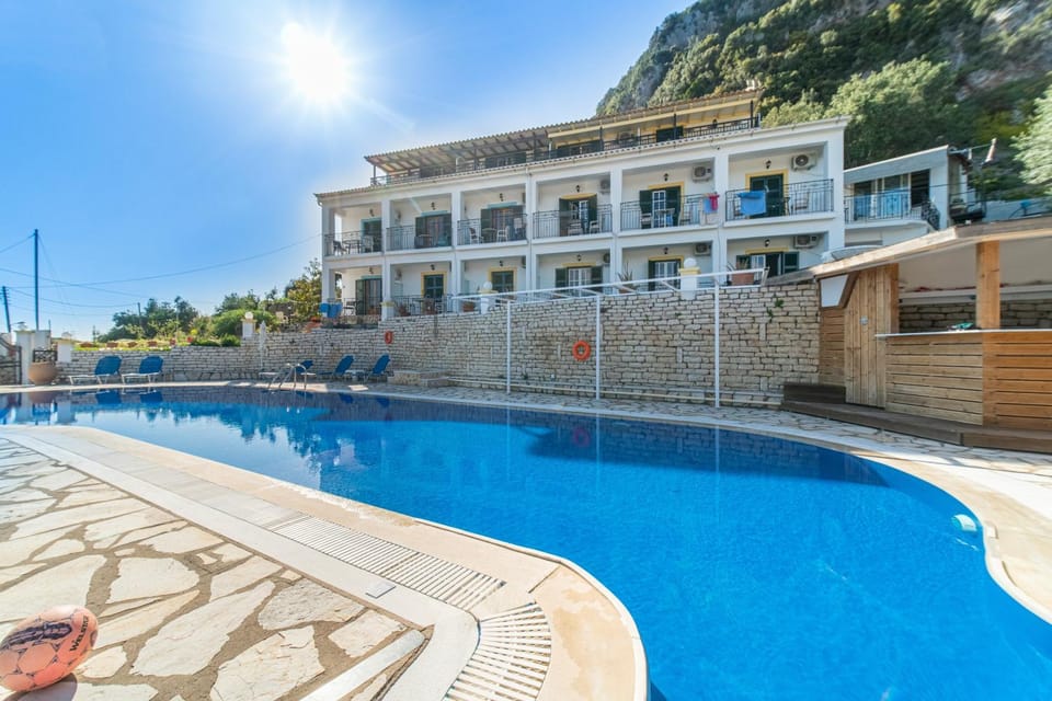 Property building, Living room, Swimming pool