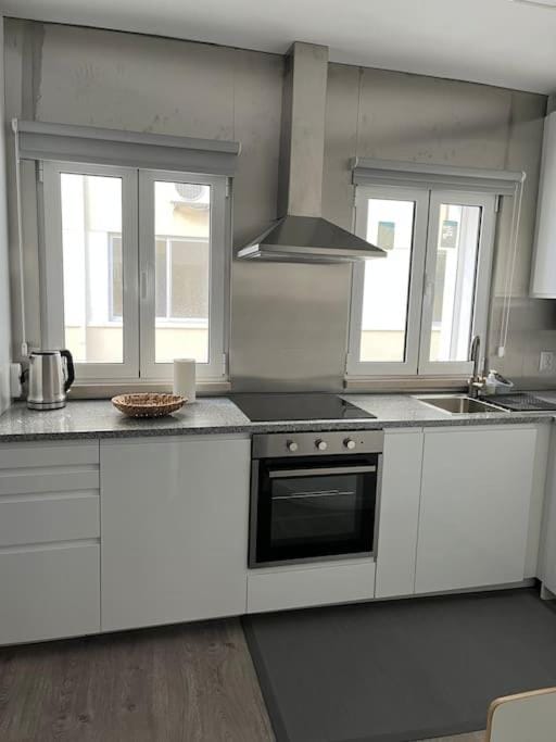 Kitchen or kitchenette, dishwasher, stove, toaster