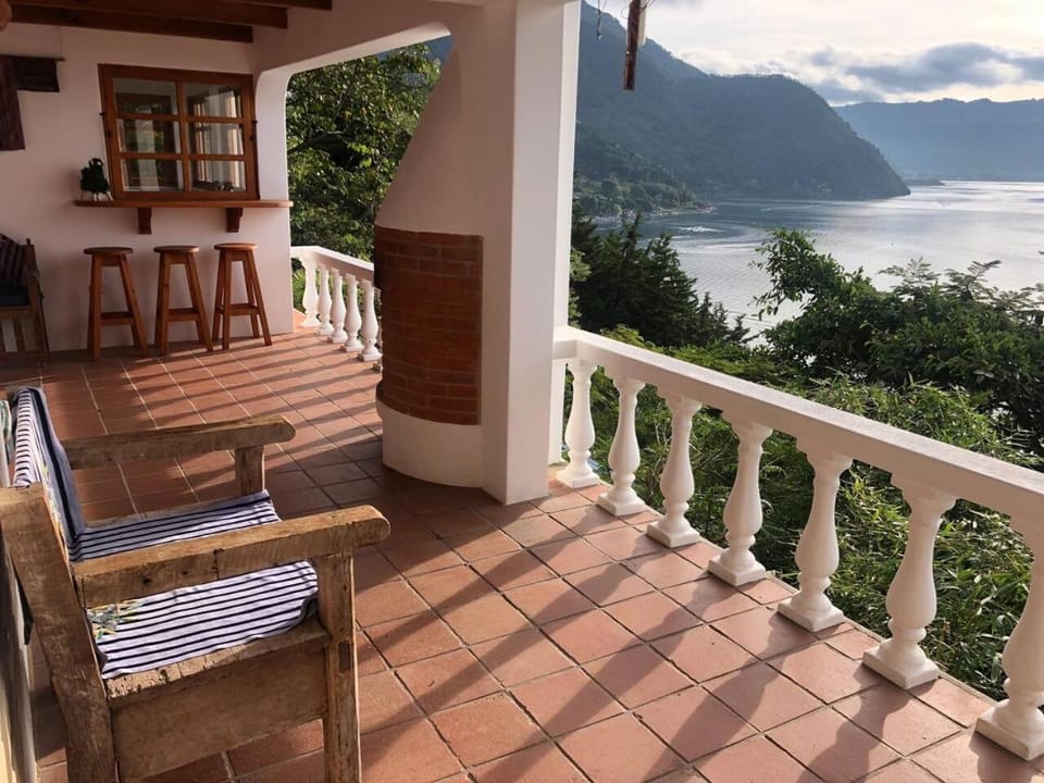 View (from property/room), Balcony/Terrace, Living room, Seating area, Lake view, Mountain view