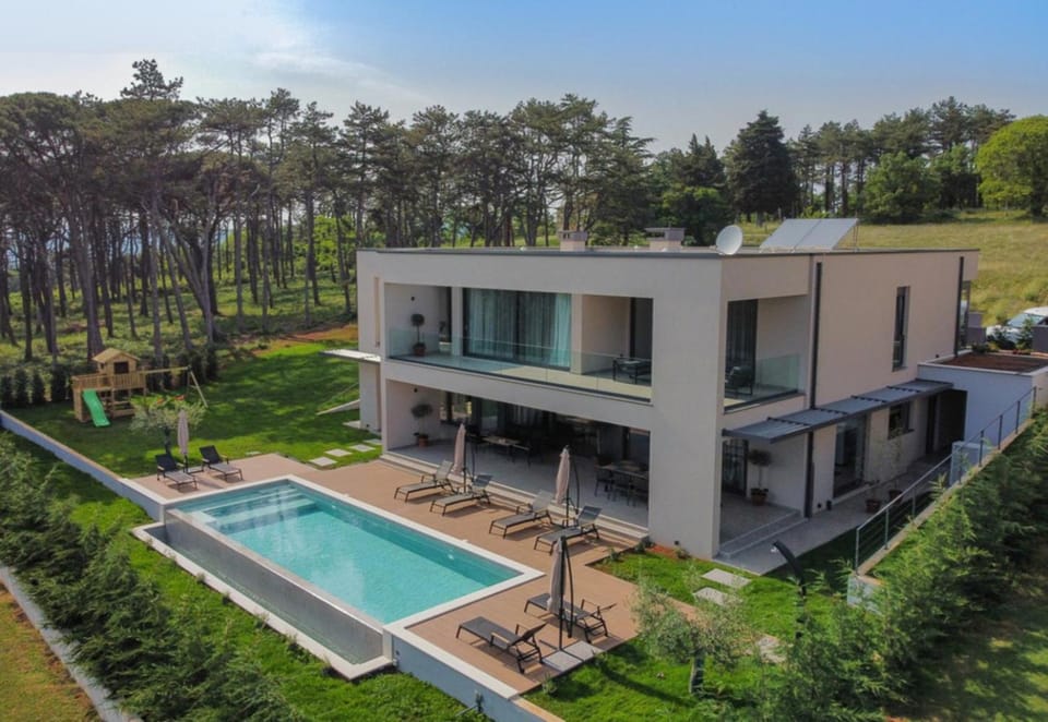 Property building, Facade/entrance, Off site, Day, Natural landscape, Children play ground, Photo of the whole room, Pool view, Swimming pool