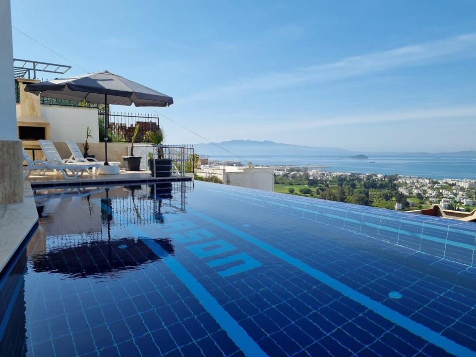 Patio, Natural landscape, BBQ facilities, View (from property/room), Balcony/Terrace, Dining area, Garden view, Mountain view, Pool view, Sea view, Swimming pool, Sports, internet, sunbed, towels