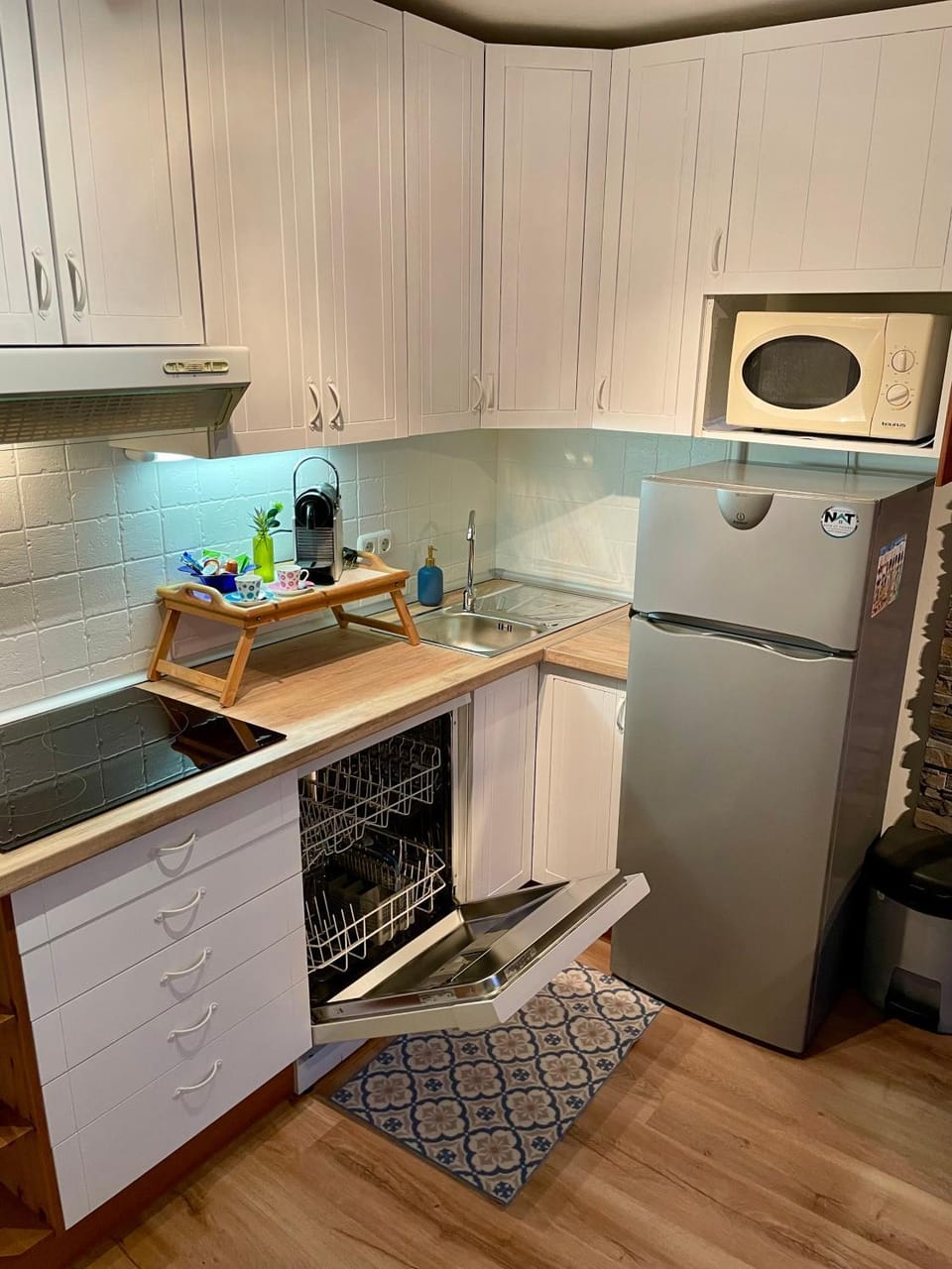 Kitchen or kitchenette, dishwasher, oven, stove