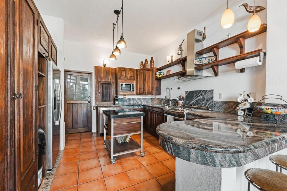Kitchen or kitchenette, dishwasher, oven, stove