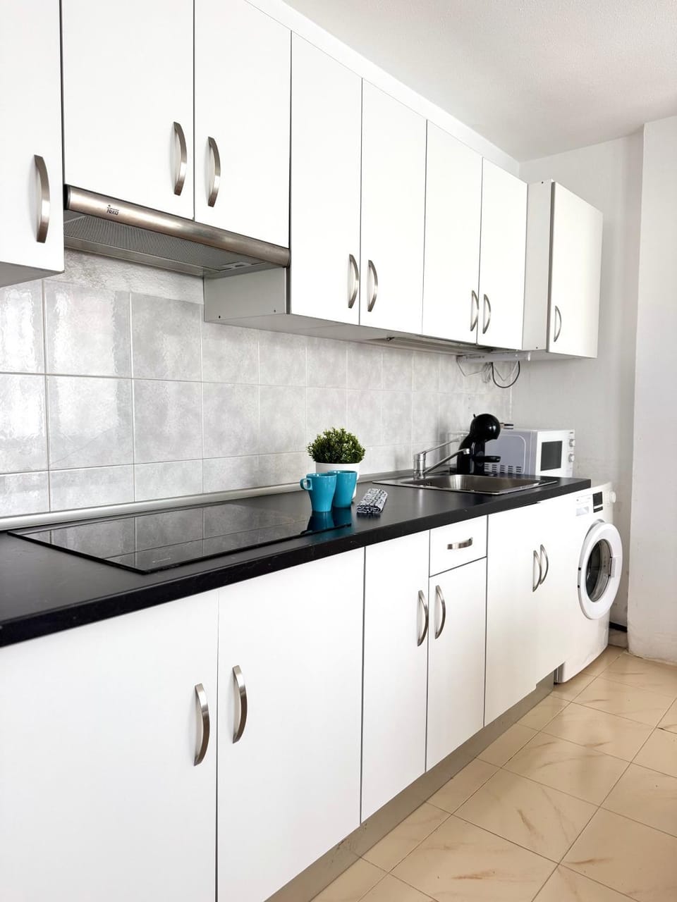 Kitchen or kitchenette, washing machine