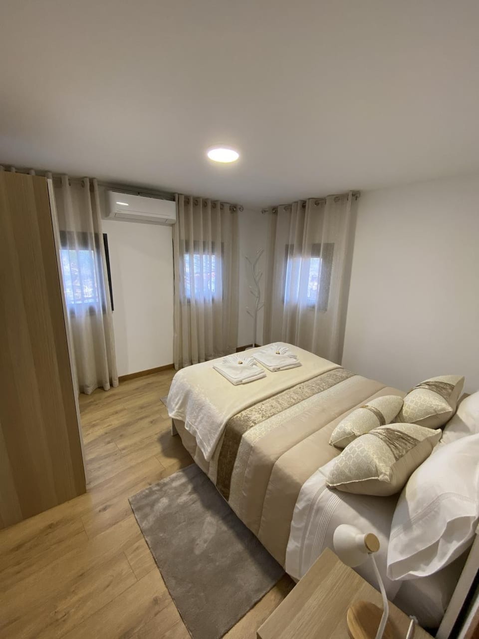 Bedroom, towels, wardrobe, air conditioner