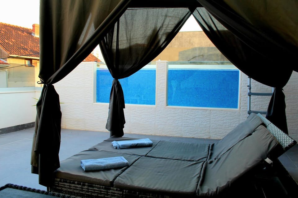 View (from property/room), Balcony/Terrace, Pool view, Swimming pool, sunbed, towels