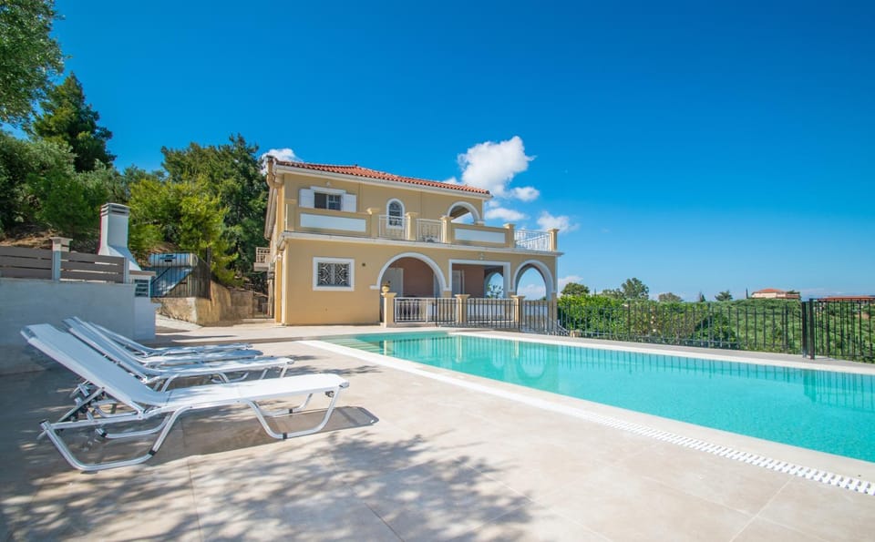 Property building, Patio, Day, Natural landscape, Pool view, Swimming pool, sunbed