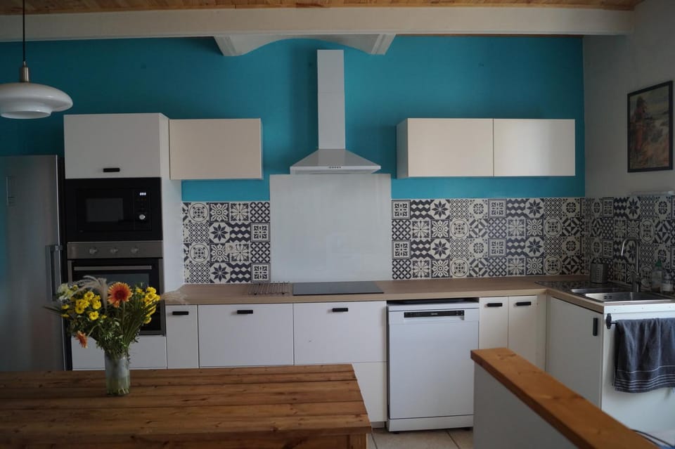 Kitchen or kitchenette, dishwasher, microwave, oven, stove