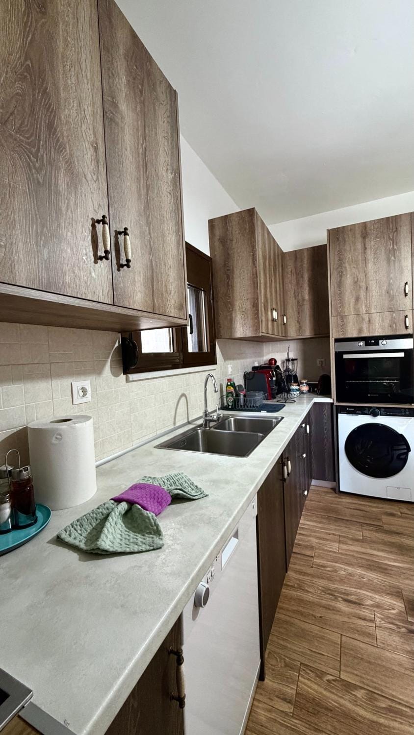 Kitchen or kitchenette, dishwasher, stove, washing machine, dryer