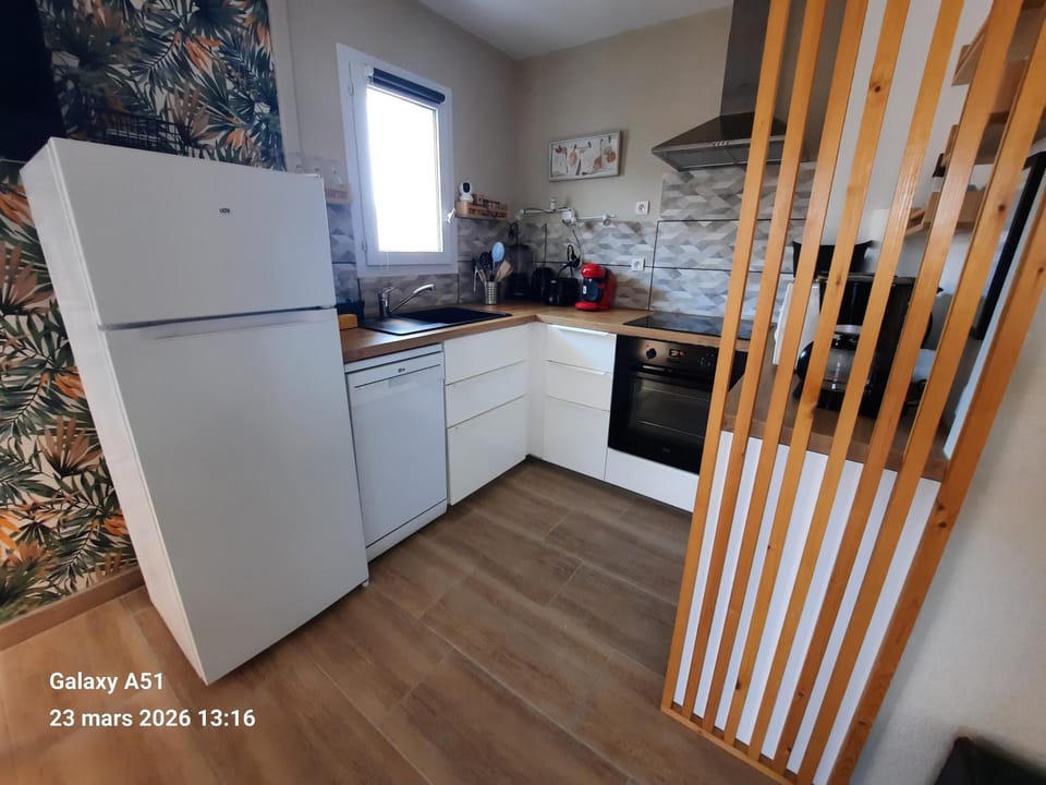 Kitchen or kitchenette, dishwasher, oven, stove
