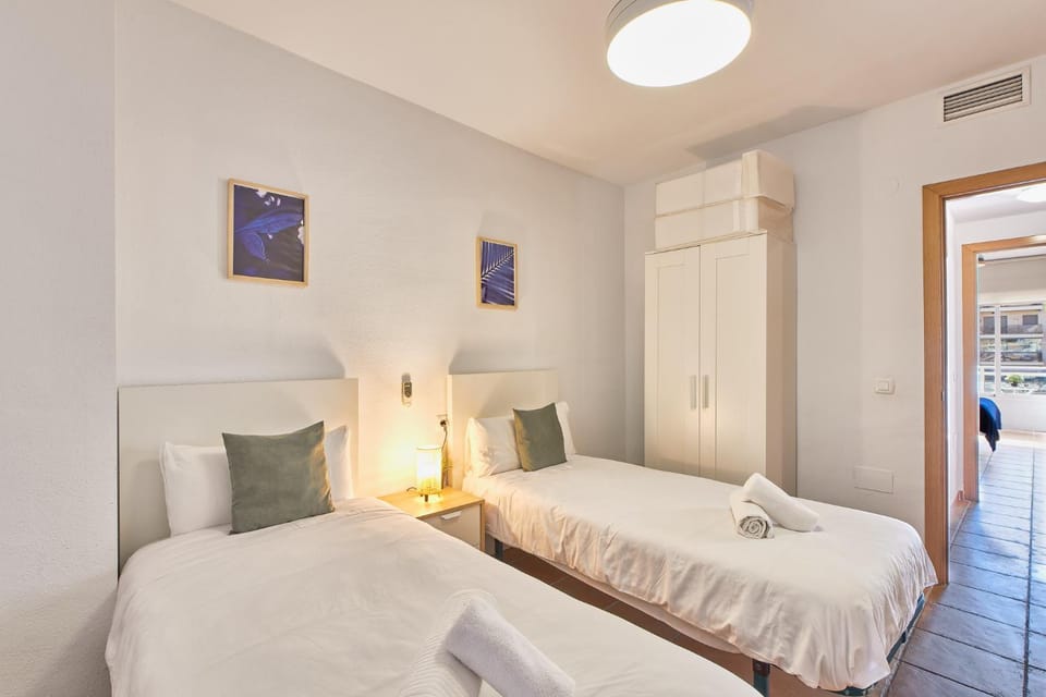Bed, towels, wardrobe