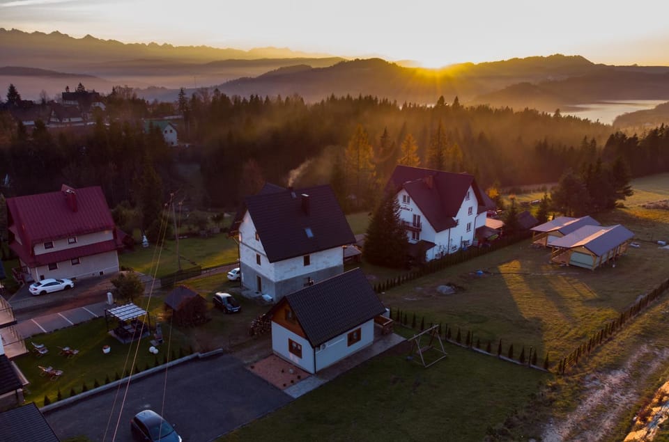 Property building, Nearby landmark, Neighbourhood, Natural landscape, Mountain view, Sunset