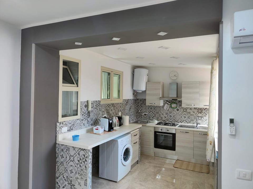 Kitchen or kitchenette, oven, stove, washing machine