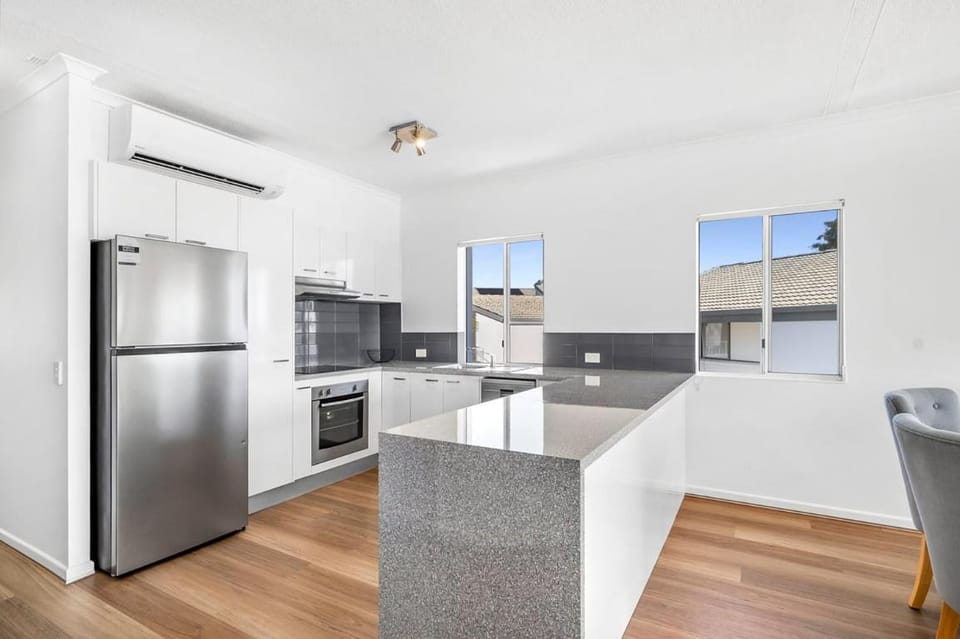 Kitchen or kitchenette, dishwasher, oven, stove