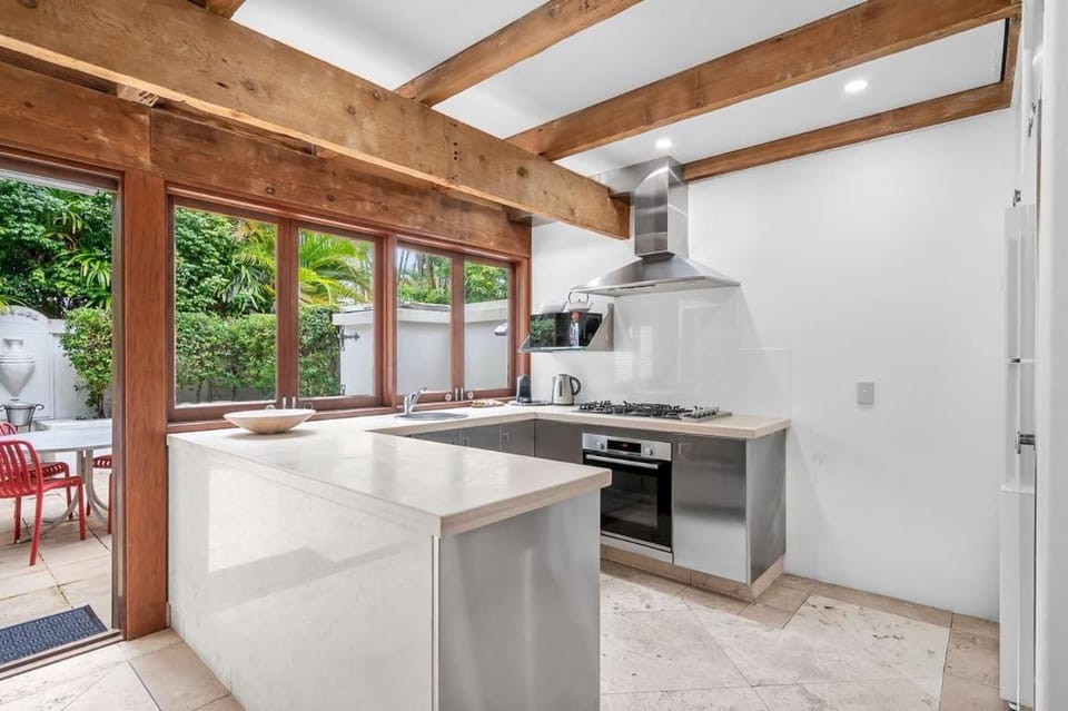 Kitchen or kitchenette, dishwasher, oven, stove