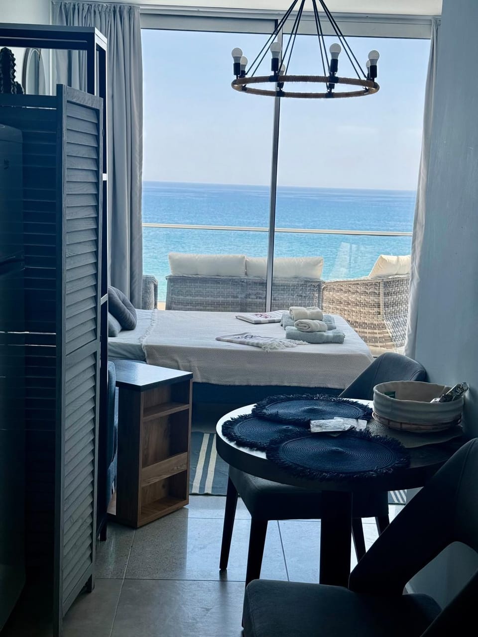 Bed, View (from property/room), Living room, Dining area, Sea view