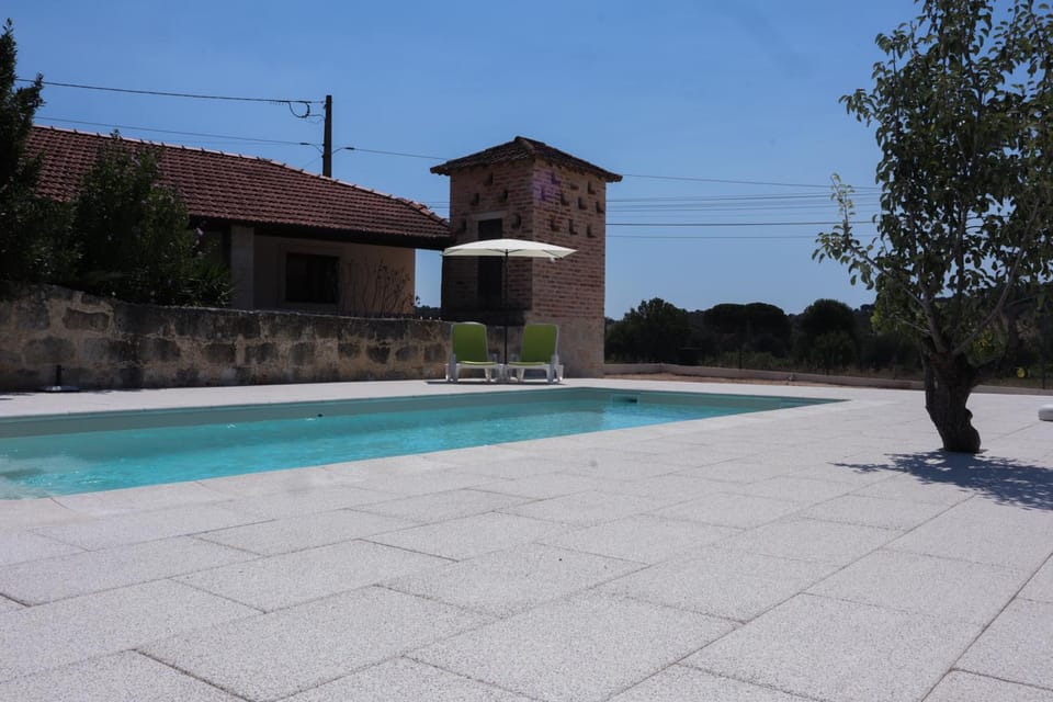 Property building, Patio, Pool view, Swimming pool, sunbed