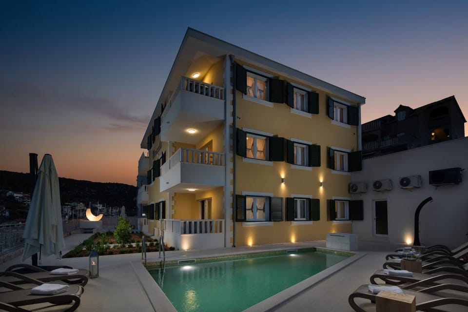 Property building, Patio, Night, Pool view, Swimming pool, sunbed