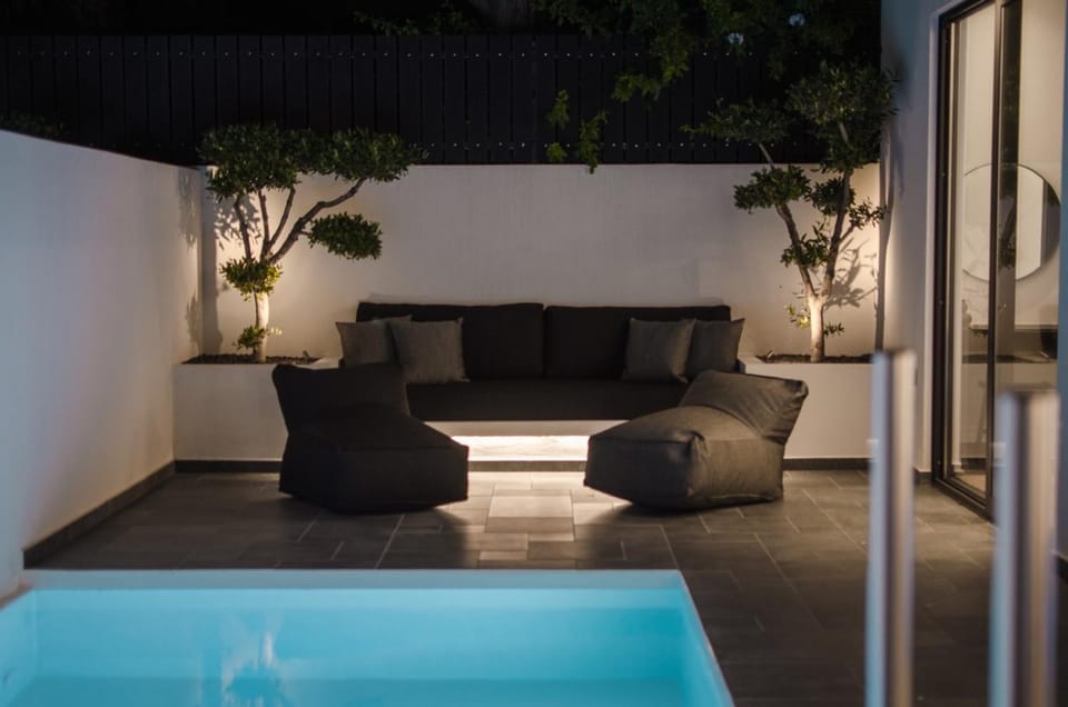 Night, Living room, Seating area, Pool view, Swimming pool