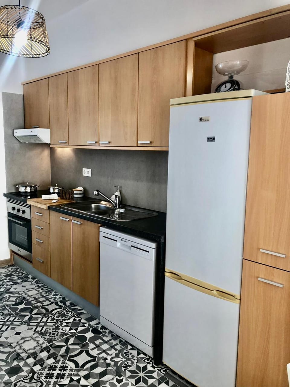 Kitchen or kitchenette, dishwasher, oven, stove